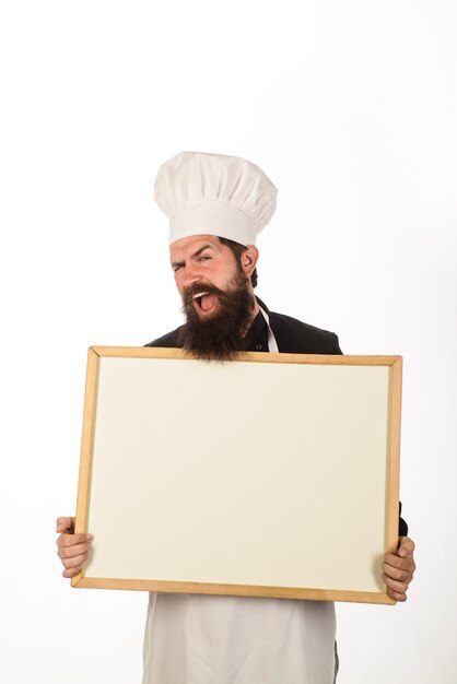 Healthy menu man chef holds blank board for text advertising copy space for restaurant advertising