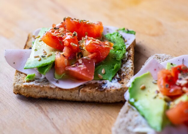 Healthy menu of toast with turkey avocado cherry tomato and cheese