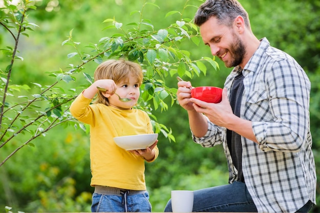 Healthy nutrition concept Nutrition habits Family enjoy homemade meal Healthy breakfast Father son eat food Little boy and dad eat Nutrition kids and adults Tasty porridge Organic nutrition