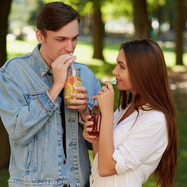 Healthy nutrition. Couple drinking fresh juice detox tea.