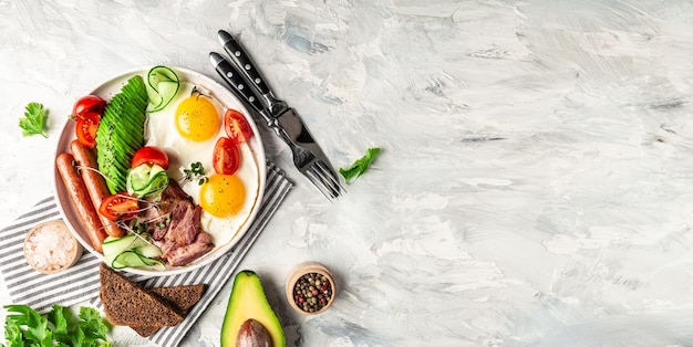 Healthy nutritious paleo keto breakfast diet Fried eggs bacon avocado cheese and fresh salad Keto breakfast or lunch banner catering menu recipe place for text top view
