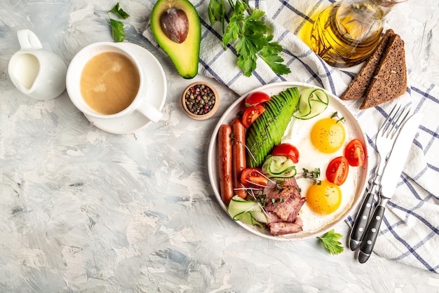 Healthy nutritious paleo keto breakfast diet Fried eggs bacon avocado cheese and fresh salad Keto breakfast or lunch Delicious balanced food concept