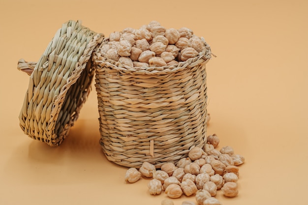 Healthy organic dried chickpeas in a straw basket