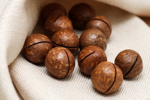 Healthy, organic inshell macadamia nuts. An expensive nut for the keto diet.