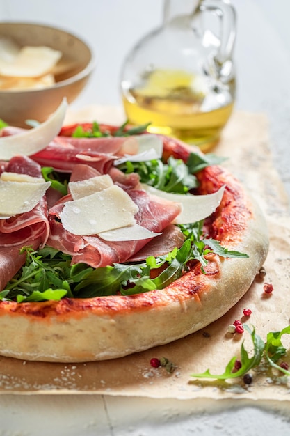 Healthy pizza Parma with parma ham and parmesan cheese