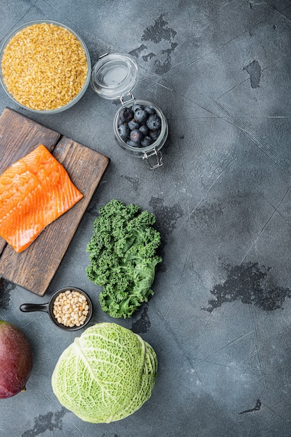 Healthy products, flat lay, on grey table.