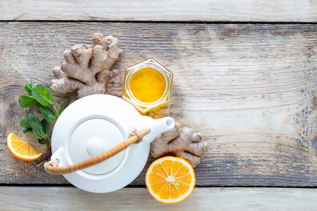 Healthy products for Immunity boosting on wooden background with copy space top view. Lemon, nuts, ginger to immune system