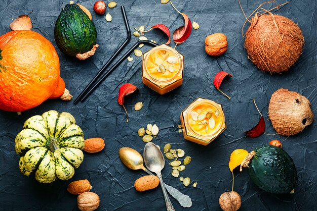 Healthy pumpkin smoothie in glass jars.Traditional autumn dishes.Halloween drink