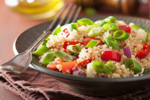 Healthy quinoa salad with tomato cucumber onion chives