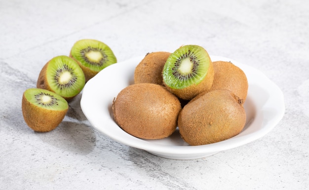 Healthy ripe whole kiwi fruit and half kiwi fruit