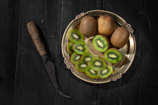 Healthy ripe whole kiwi fruit and half kiwi fruit