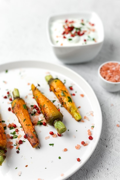 Healthy roasted carrots On white background