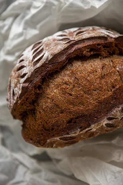 Healthy rye bread slices on the plate on concrete background