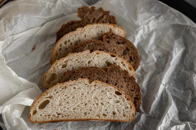 Healthy rye bread slices on the plate on concrete background