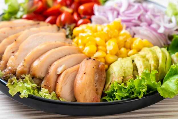 Healthy salad bowl with chicken breast