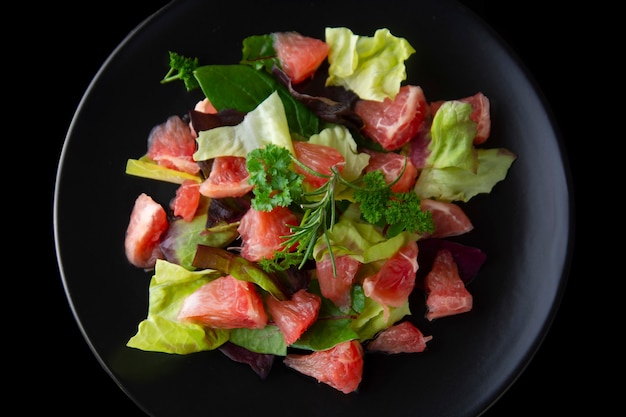 Healthy salad grapefruit and green leaves. Deliciouse dietary food. lose weigh.