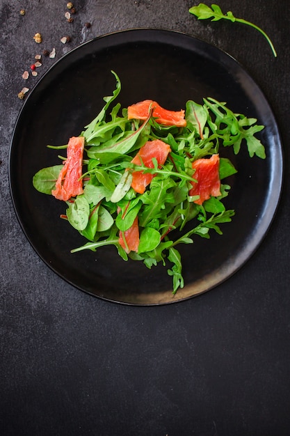 Healthy salad leaves mix, salmon or tuna