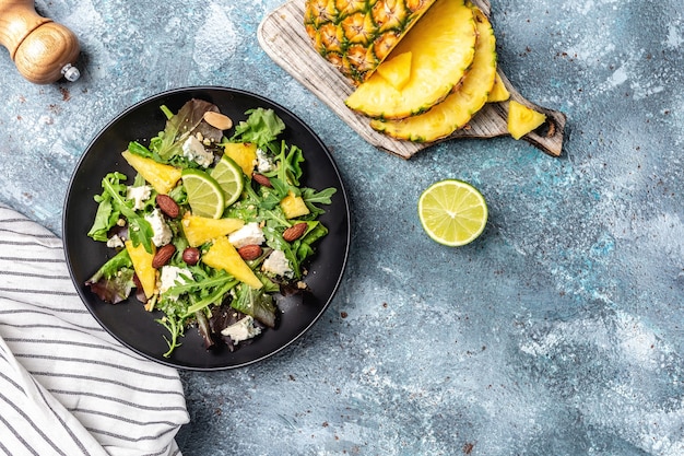 Healthy salad of pineapple, blue cheese and almond