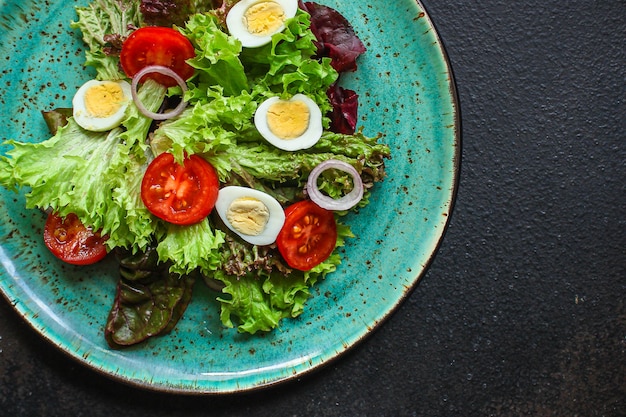 healthy salad quail eggs vegetables, tomato, lettuce