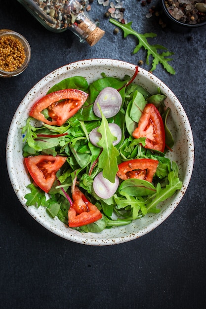 healthy salad tomato, mix leaves, onions and other ingredients