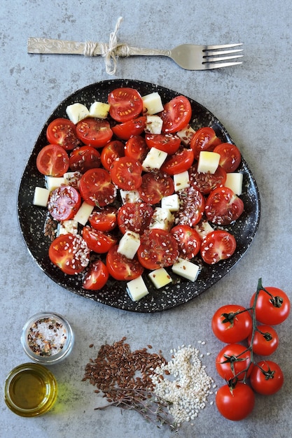 Healthy salad with cherry tomatoes and cheese
