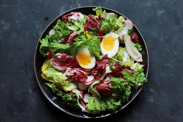 Healthy salad with herbs and eggs