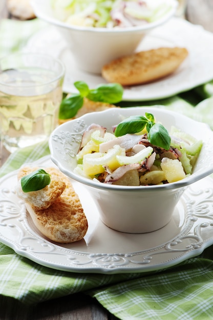 Healthy salad with octopus, celery and potato