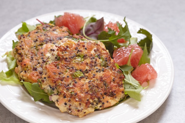 Healthy salmon quinoa kale burger