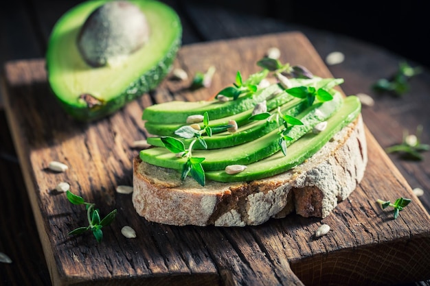 Healthy sandwich with avocado and herbs and seeds