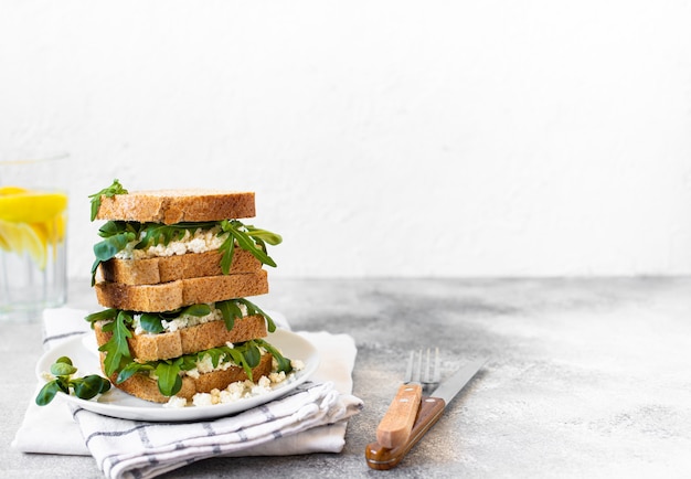 Healthy sandwich with ricotta and arugula