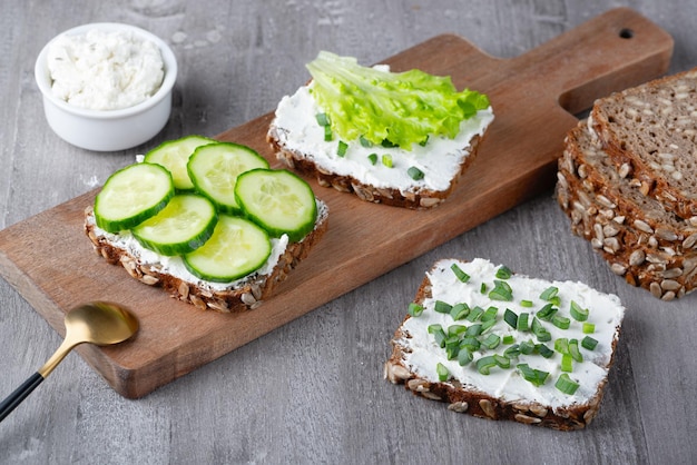 Healthy sandwich with white cottage cheese and cucumber