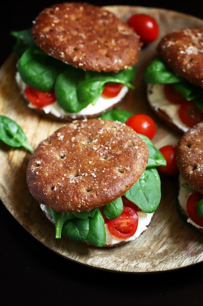 Healthy sandwiches with spinach cherry tomatoes and white cheese Useful snack Keto diet