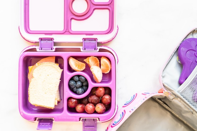 Photo healthy school lunch packed in a bento box for a little girl.