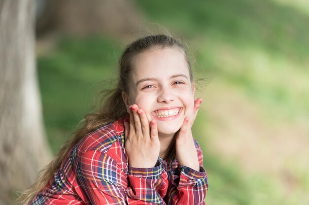 A healthy smile begins with a child Smiling kid with white healthy smile on beautiful face Cute small child with long blond hair and happy smile Adorable little girl with big smile