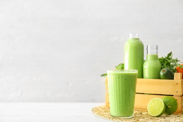 Healthy smoothie on white table