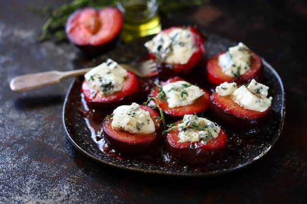 Healthy snack Baked plums with feta cheese