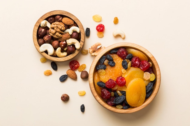 healthy snack mixed nuts and dried fruits in bowl on table background almond pineapple cranberry cherry apricot cashew