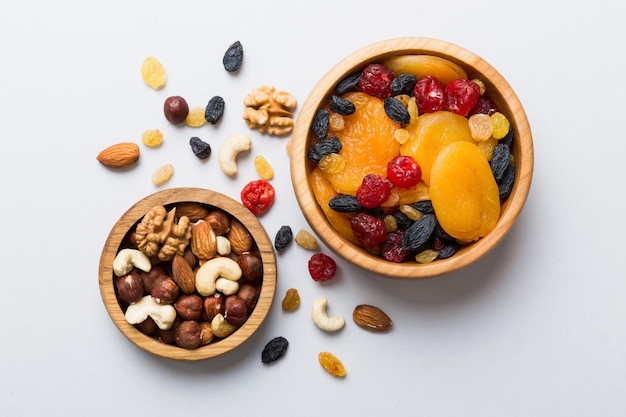 healthy snack mixed nuts and dried fruits in bowl on table background almond pineapple cranberry cherry apricot cashew
