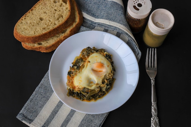 Healthy spinach omelet Eggs with spinach on a plate