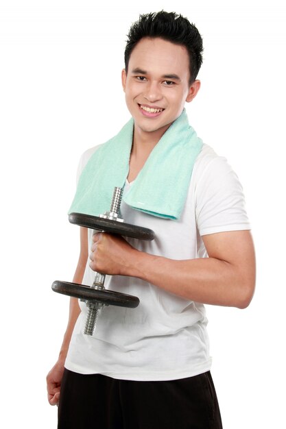 Healthy sports man with dumbbell smiling