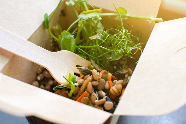 Healthy street food. Fresh Microgreen and vegetables. Natural eco food with vitamins. Vegetarian lifestyle. Cardboard kraft eco recycle box.