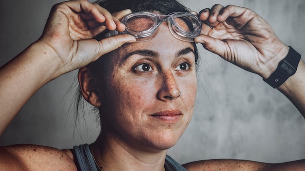 Healthy and strong female swimmer portrait