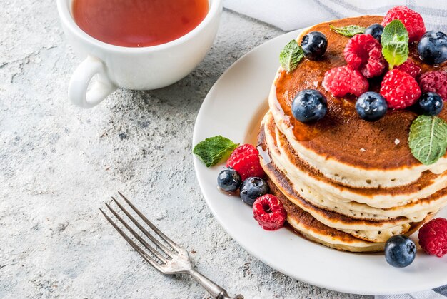 Healthy summer breakfast,homemade classic american pancakes with fresh berry