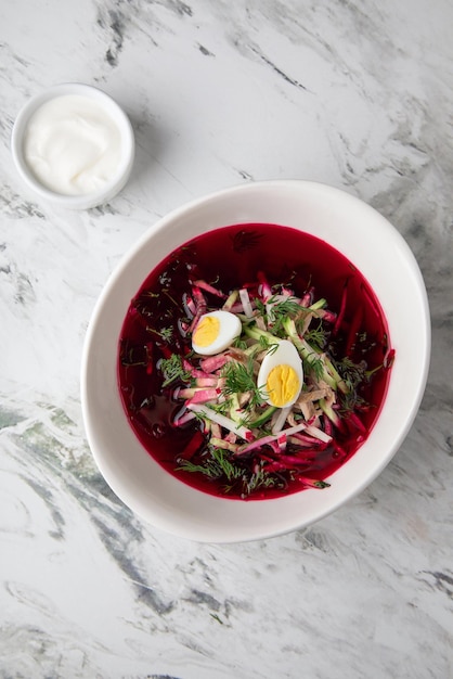 Healthy take away food and drinks in disposable soup with vegetable salad