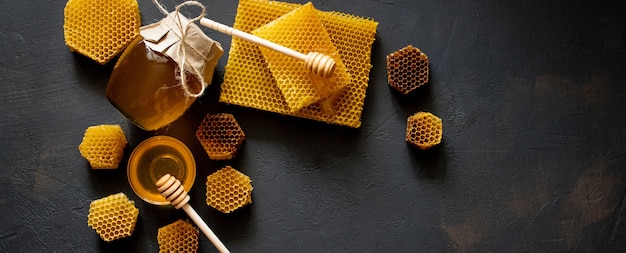 Healthy Thick honey dipping from the wooden honey spoon, bee products by organic natural ingredients concept.