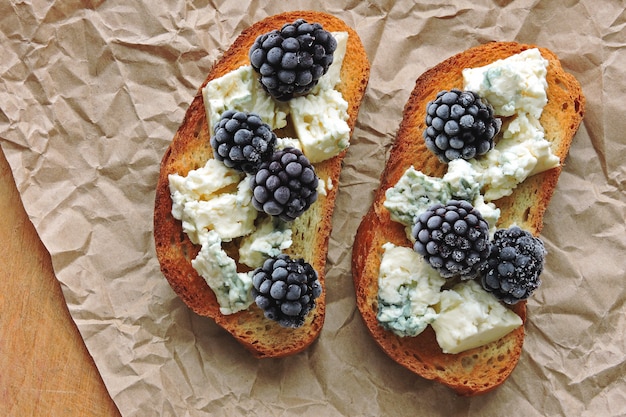 Healthy toasts with blue cheese and blackberries. Keto diet. Keto snack.