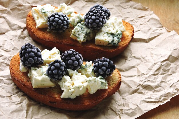 Healthy toasts with blue cheese and blackberries. Keto diet. Keto snack.