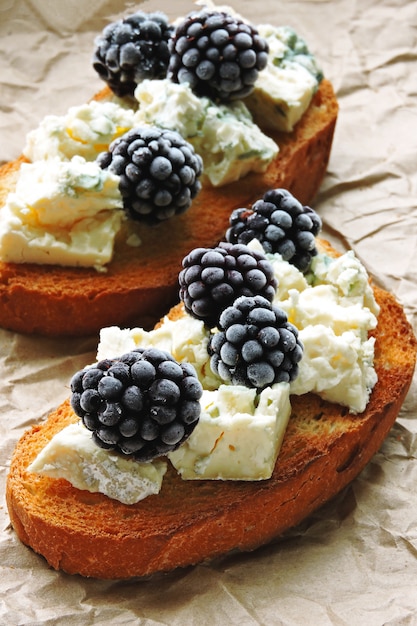 Healthy toasts with blue cheese and blackberries. Keto diet. Keto snack.