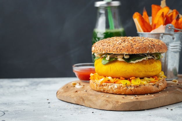 Healthy vegan burger with fresh vegetables.