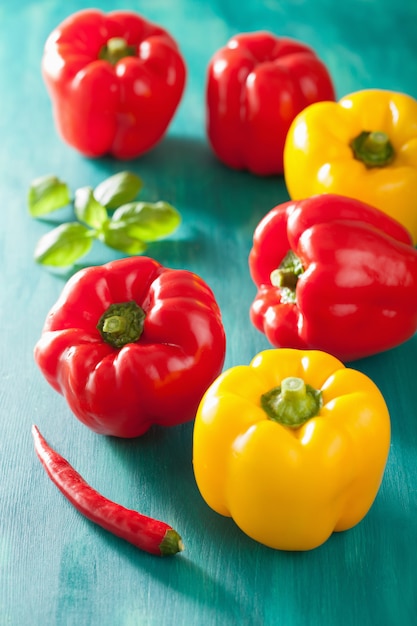 Healthy vegetable red yellow peppers on turquoise background